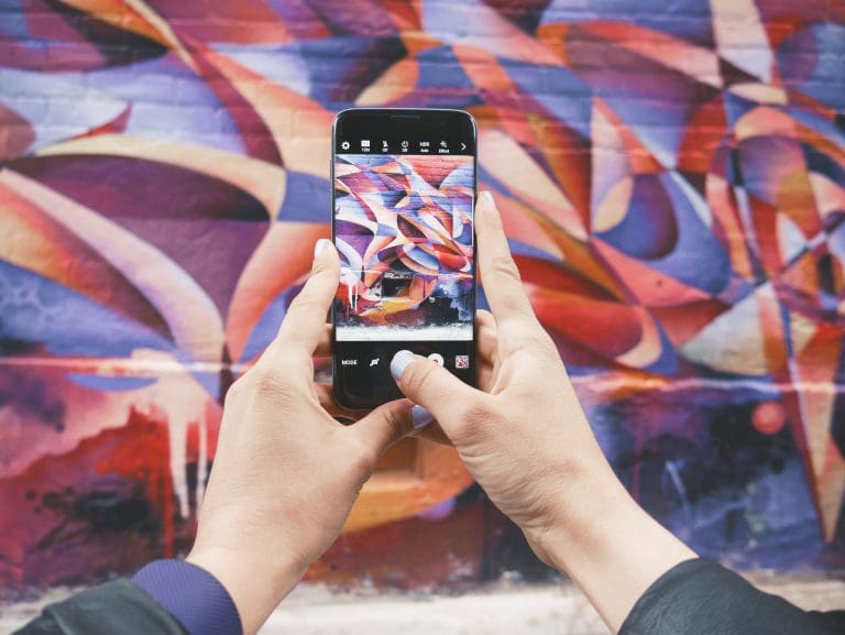 image of street art on a smart phone