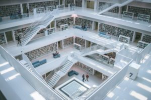 A winding white library staircase