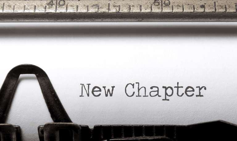 Paper in typewriter reading 'New Chapter'
